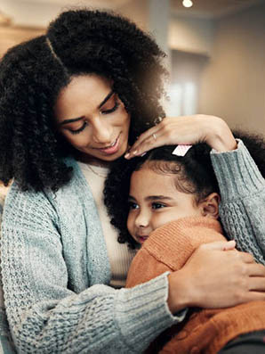 Mother hugging child