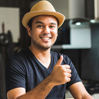 Man with hat thumbs up