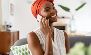 mature african woman talking over phone