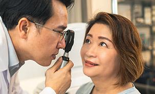 doctor giving patient an eye test